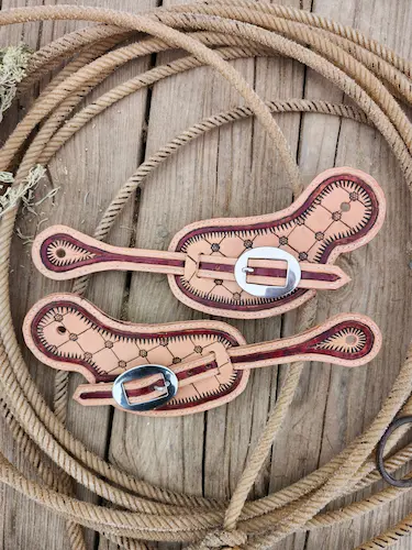 Handtooled leather spur straps: with silver buckles