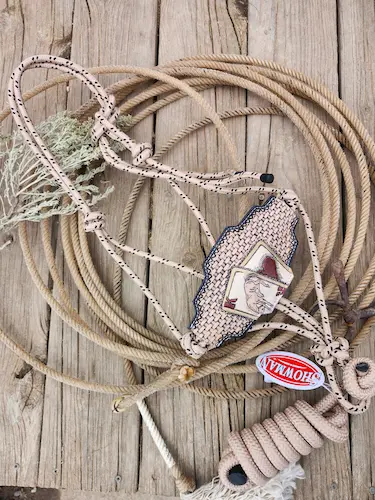 Handcrafted rope halter with hand tooled leather nose strap