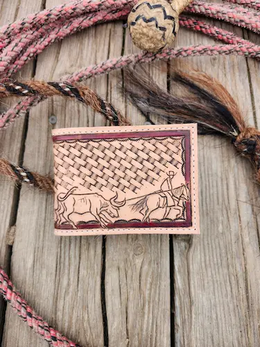 Handtooled leather wallet: steer roping